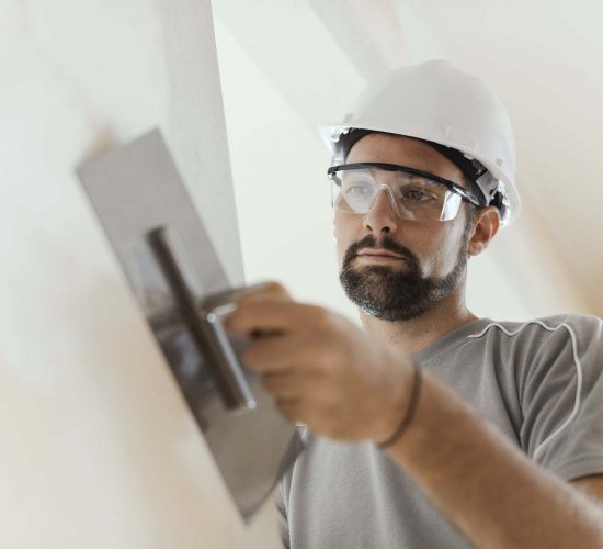 professional-craftsman-applying-plaster-with-a-trowel.jpg professional-craftsman-applying-plaster-with-a-trowel.jpg