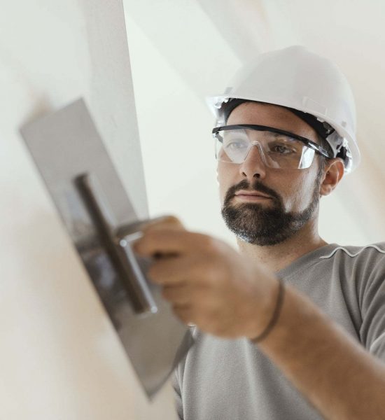 professional-craftsman-applying-plaster-with-a-trowel.jpg professional-craftsman-applying-plaster-with-a-trowel.jpg
